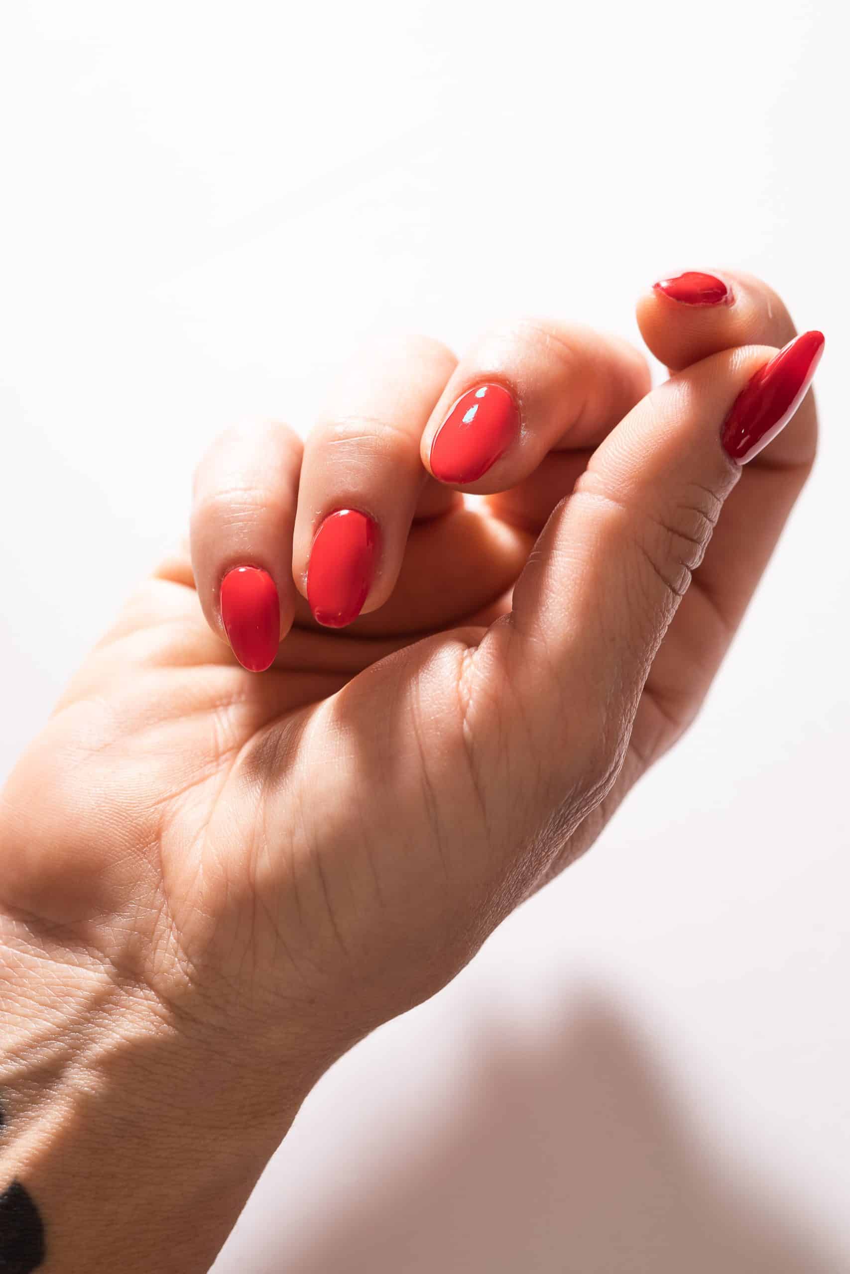 Long, glossy gel nail extensions showing finished strength and shape