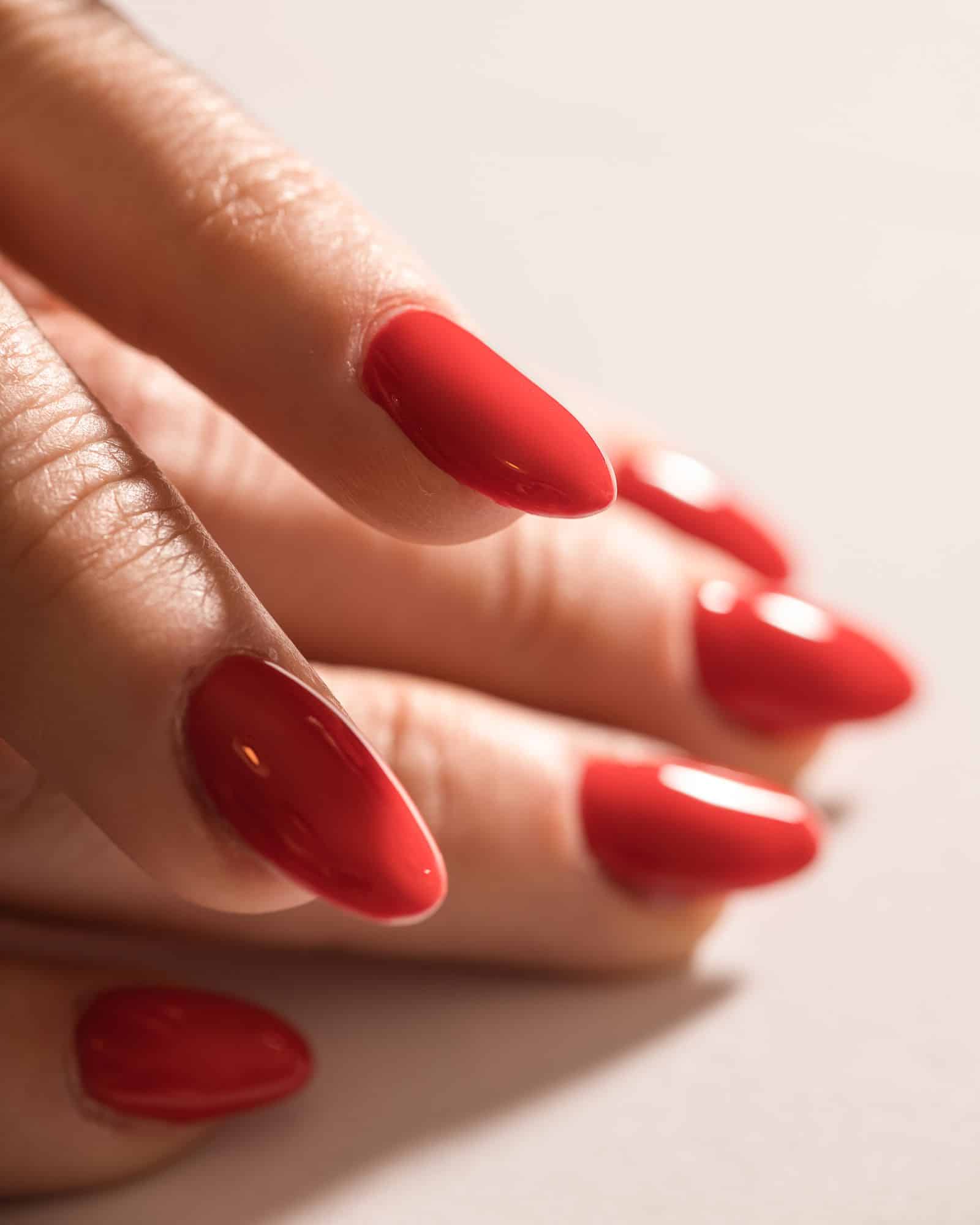 Close-up of a finished glossy nail extension manicure