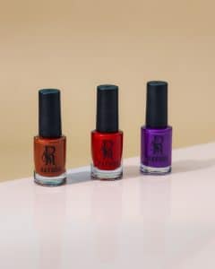 Rows of colorful nail gel and polish bottles from different brands