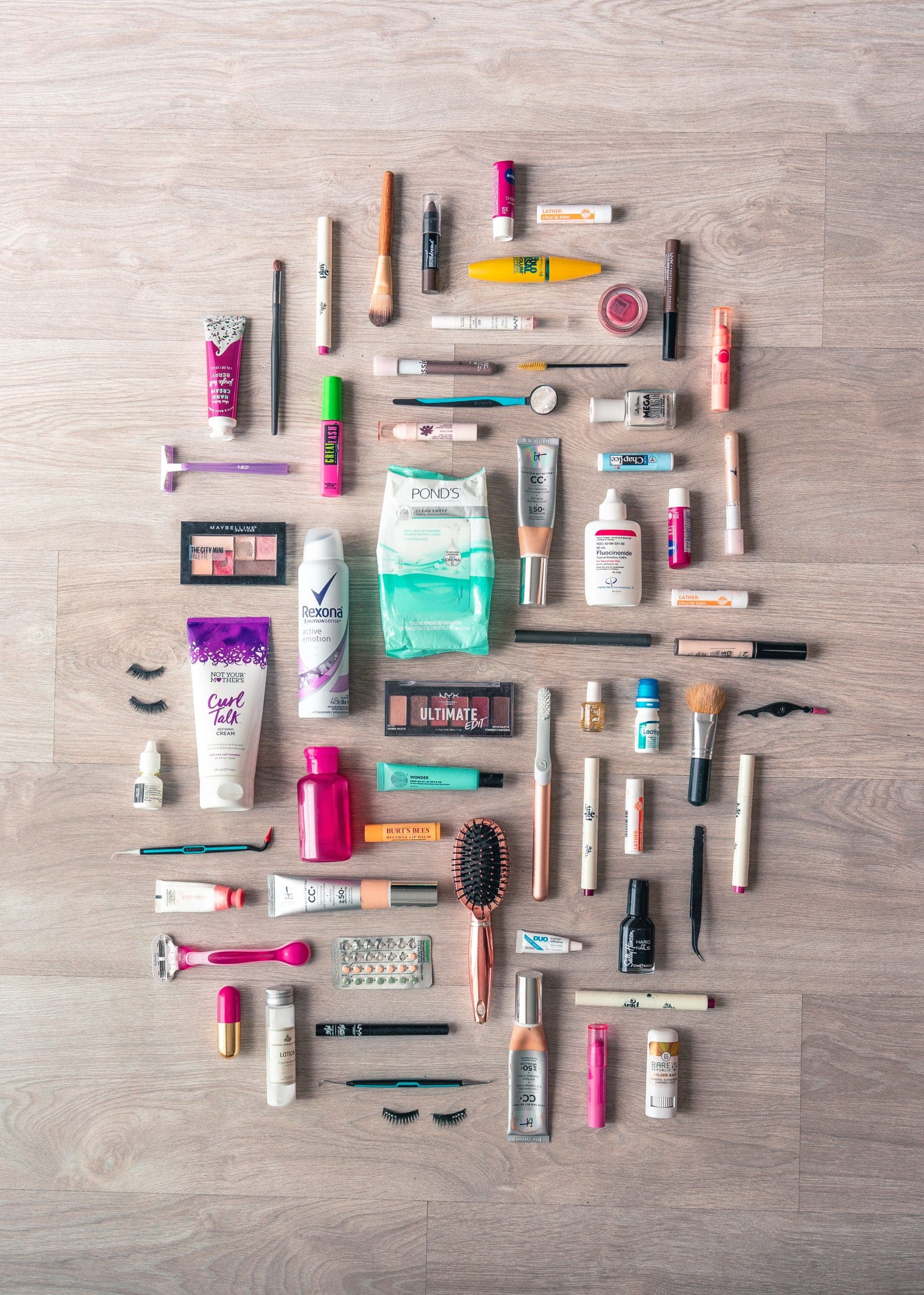 Flat lay of nail care tools and beauty products needed to patch a lifted gel nail