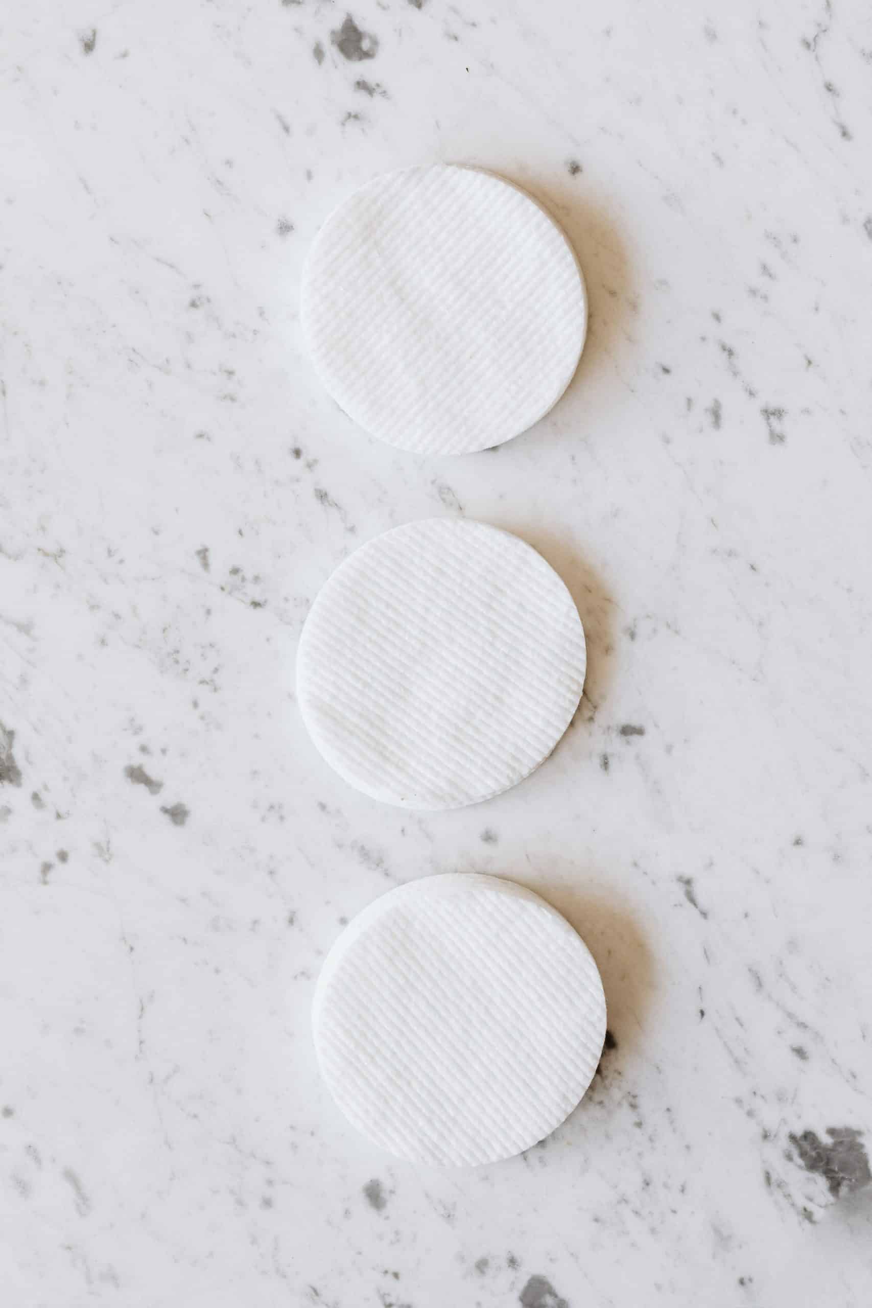 Cotton pads soaked in pure acetone are wrapped around the nail during soak-off
