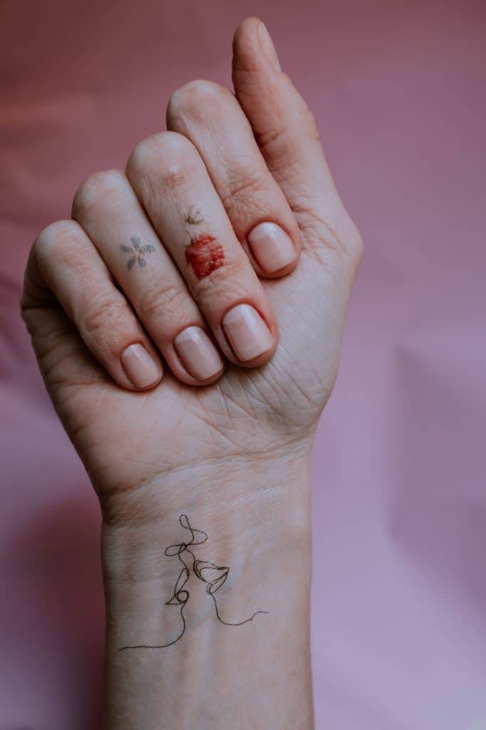 Close-up photo of a person's hand with manicured nails