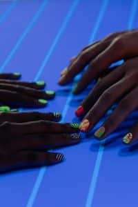 Close-up of hands with nail polish applied
