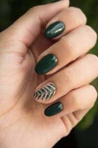 Close-up photo of a green nail art manicure