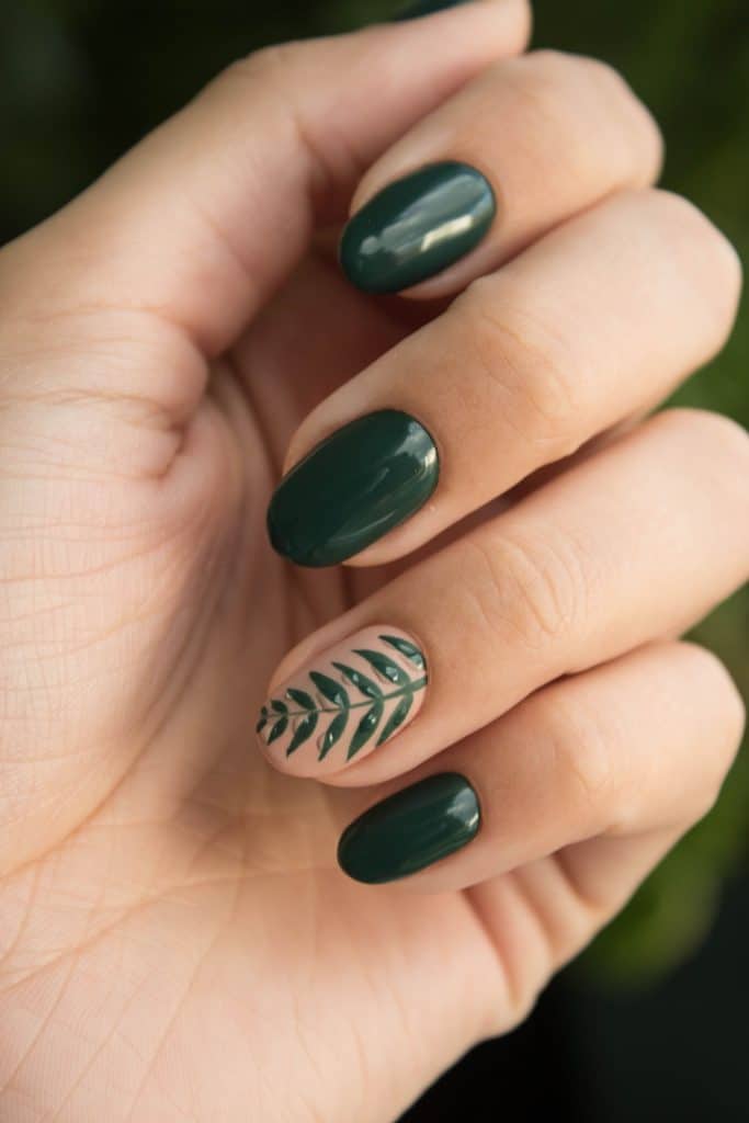 Close-up photo of a green nail art manicure