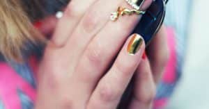 Close-up of shimmery metallic nail polish, illustrating the cat eye gel polish magnet technique